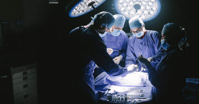 b715bb64-surgeons-performing-surgical-procedure-in-operating-theatre-859688132.png